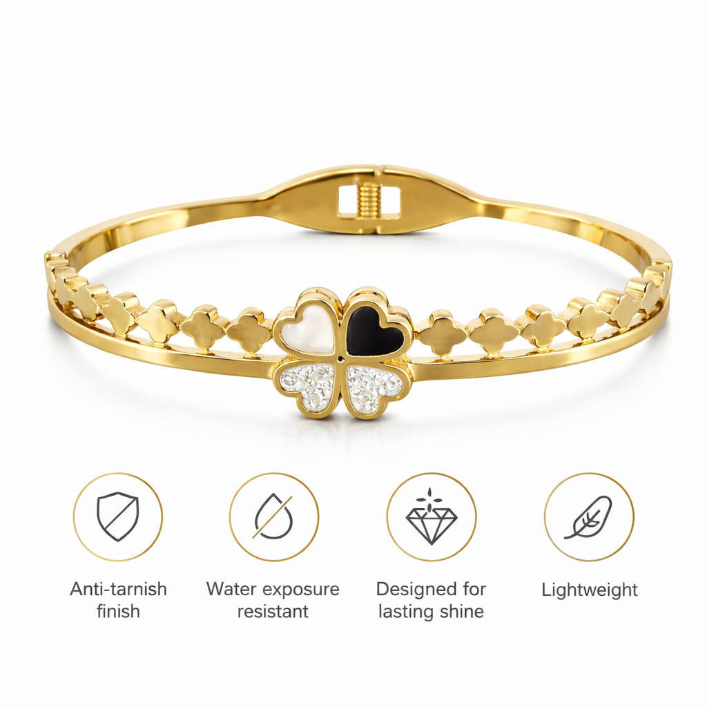 Gold bracelet with clover design on a white background