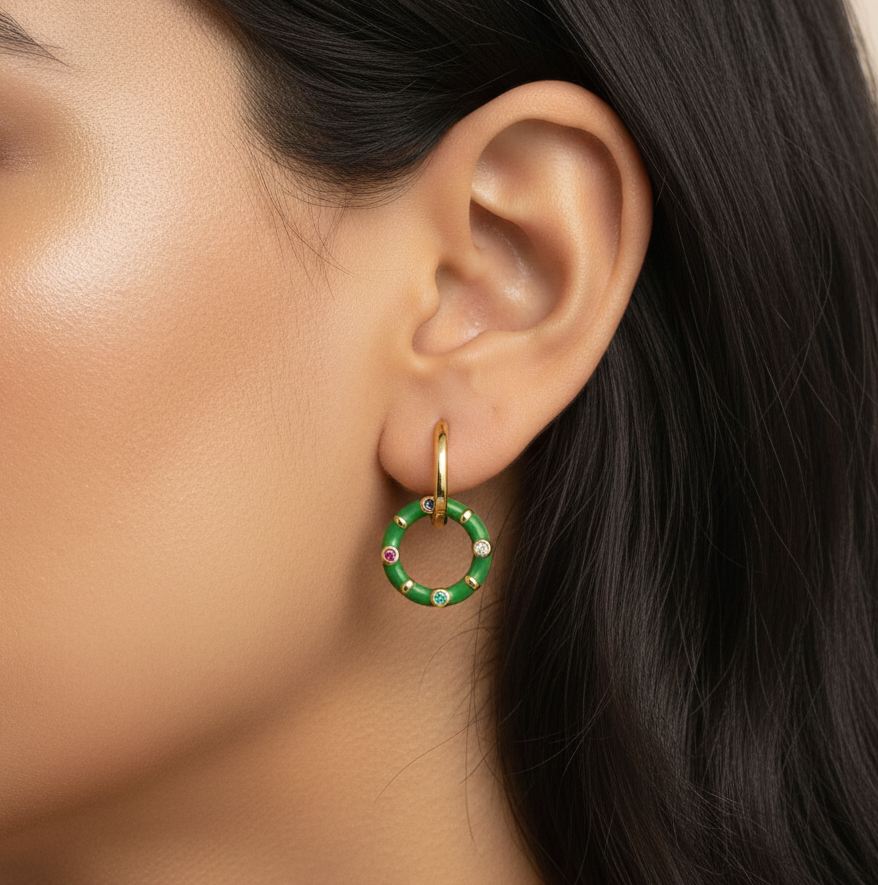 Gold plated hoop circular earrings worn by a woman styled for an everyday minimal look