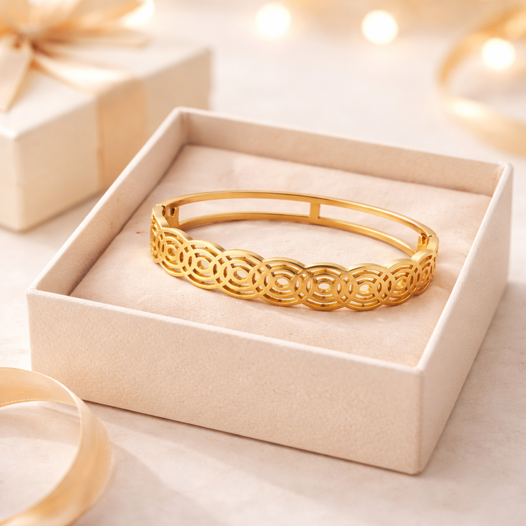Gold bracelet in a decorative box with soft lighting