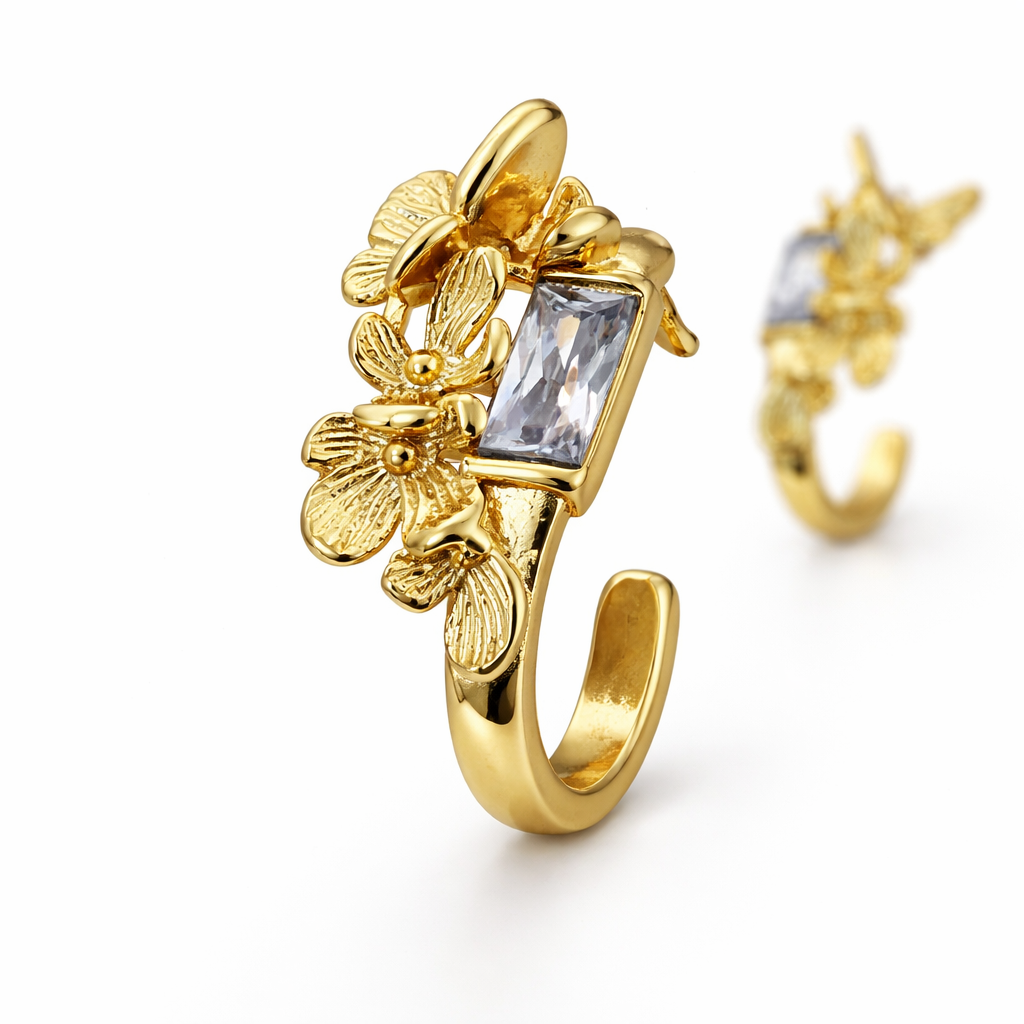 Gold plated crystal stud earrings with front earring in sharp focus and second softly blurred behind