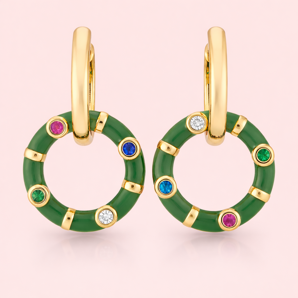 Gold plated hoop circular earrings for women displayed as a single product on clean soft blush background