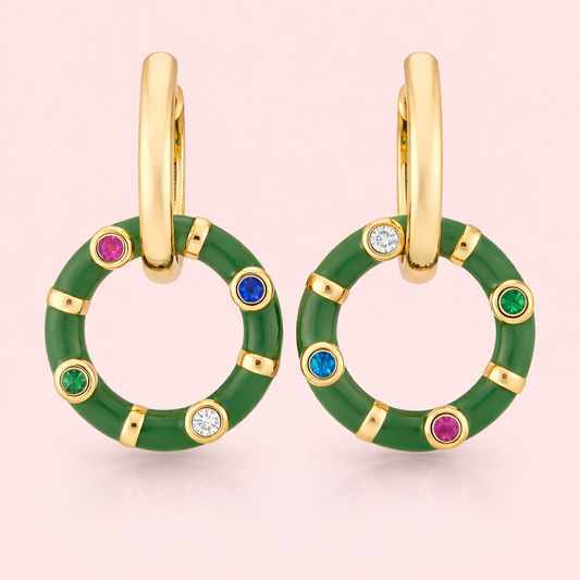 Gold plated hoop circular earrings for women displayed as a single product on clean soft blush background