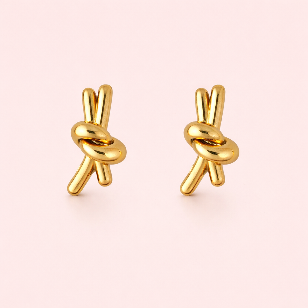 Gold plated knotted stud earrings for women displayed as a single product on clean white background