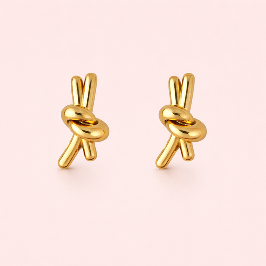 Gold plated knotted stud earrings for women displayed as a single product on clean white background