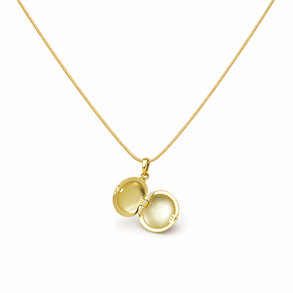 Gold locket necklace on a white background