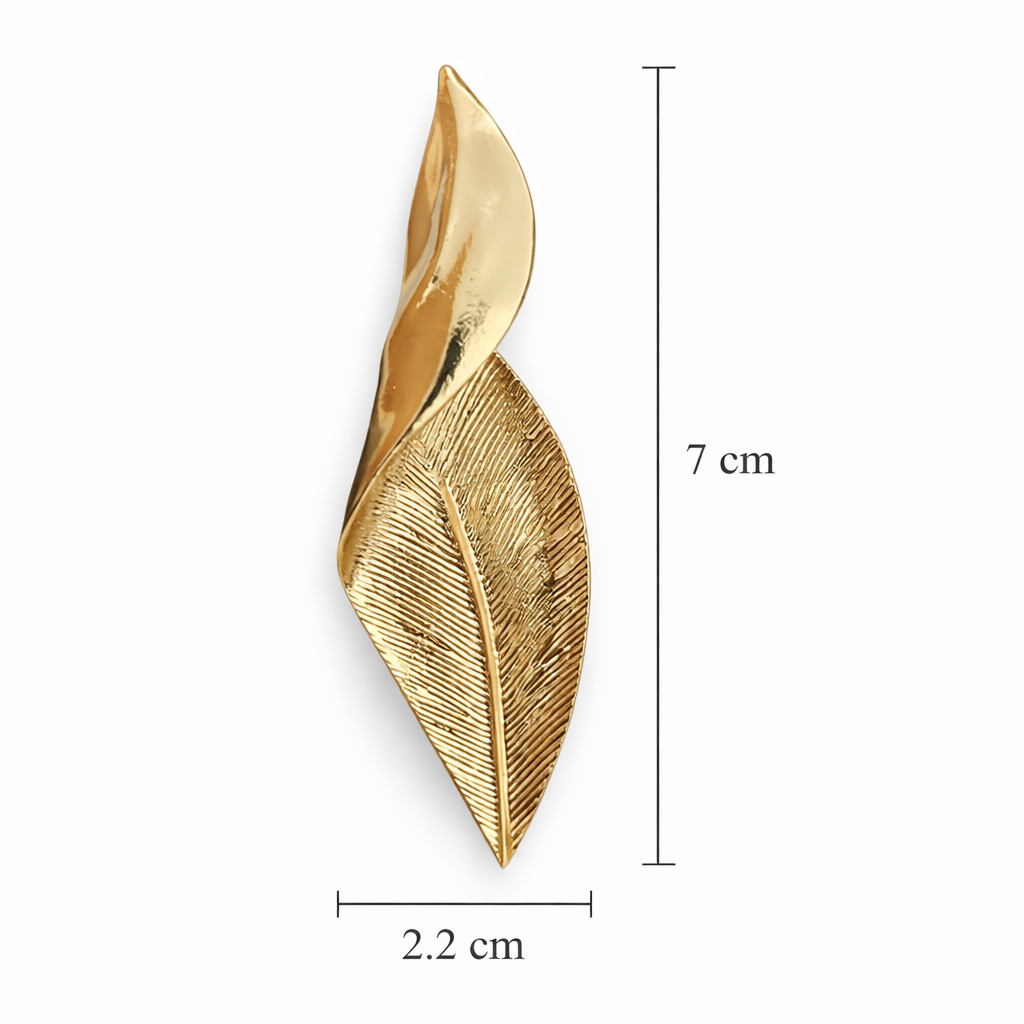 Gold leaf-shaped brooch with measurements on a white background
