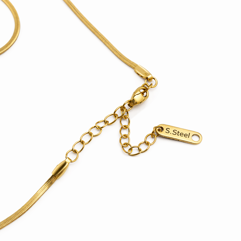 Gold necklace with a clasp and 'S.Steel' tag on a white background